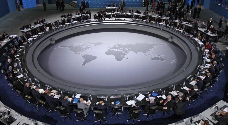 528182-leaders-of-the-g20-summit-gather-around-the-meeting-table-for-the-first-plenary-session-of-the-summi